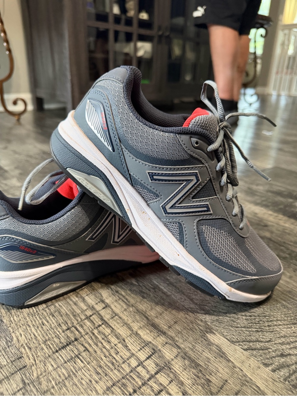 New Balance Gray Athletic Sneakers with Red Accent